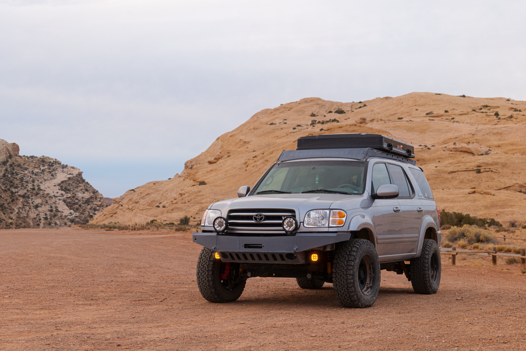 first gen sequoia with racklite industries roof rack, silver bedliner with black hardware.